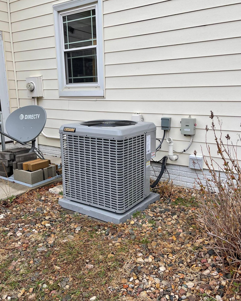 a chair sitting in front of a house