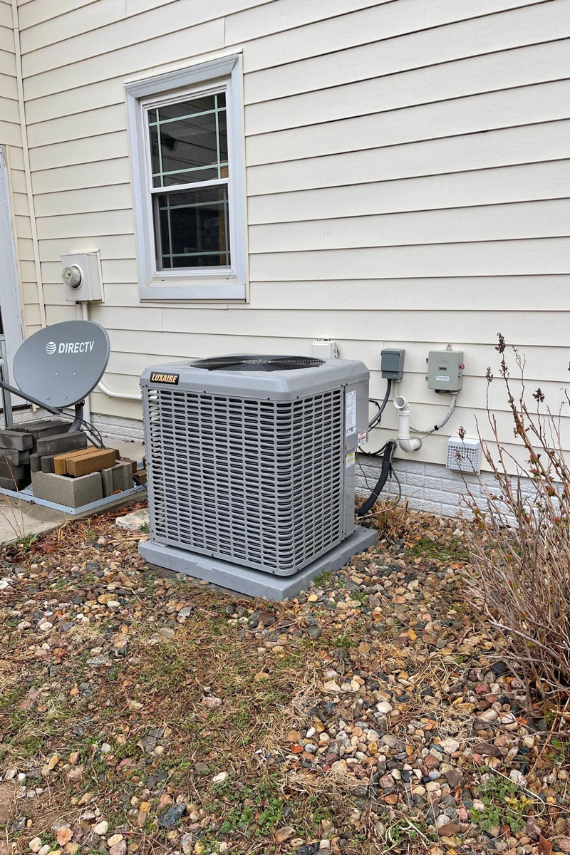 a chair sitting in front of a house